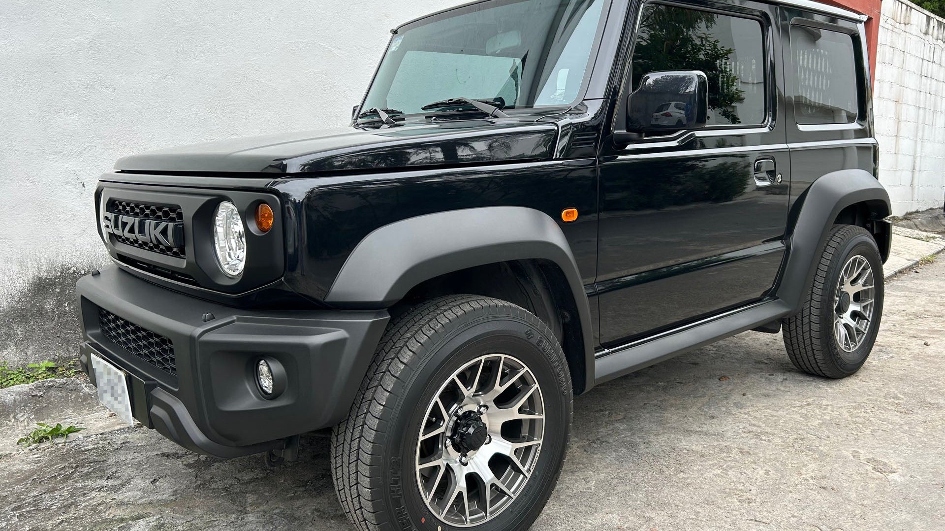 Black Suzuki Jimny (2018+) fitted with Dark Graphite DAMD Little G Wheels