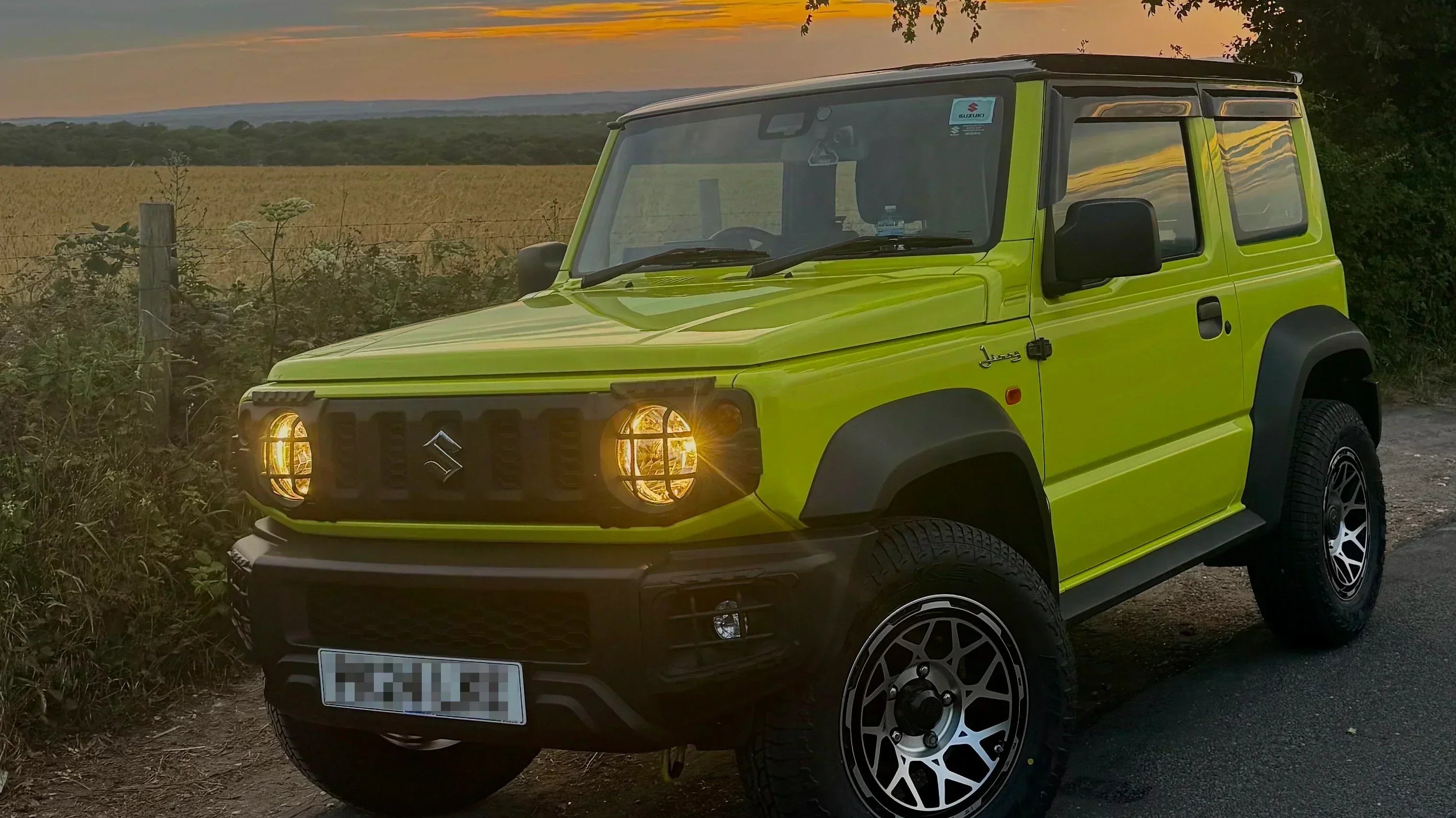 Kinetic Yellow Suzuki Jimny (2018+) with Magpie M-01 wheels in the 'Satin Black with Machined Face' colour variant