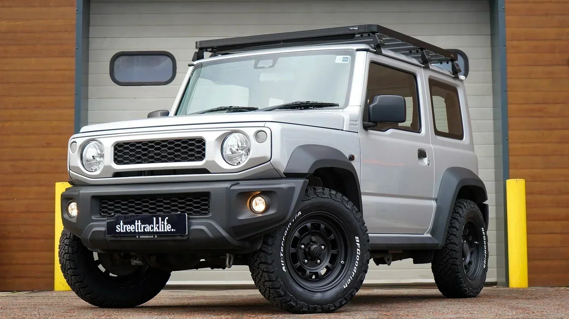 Suzuki Jimny (2018+) with 16" High Peak J-01 wheels in Matte Black, with BF Goodrich KO3 tyres, Front Runner Slimline II Roof Rack and JIMNYSTYLE LED Lights