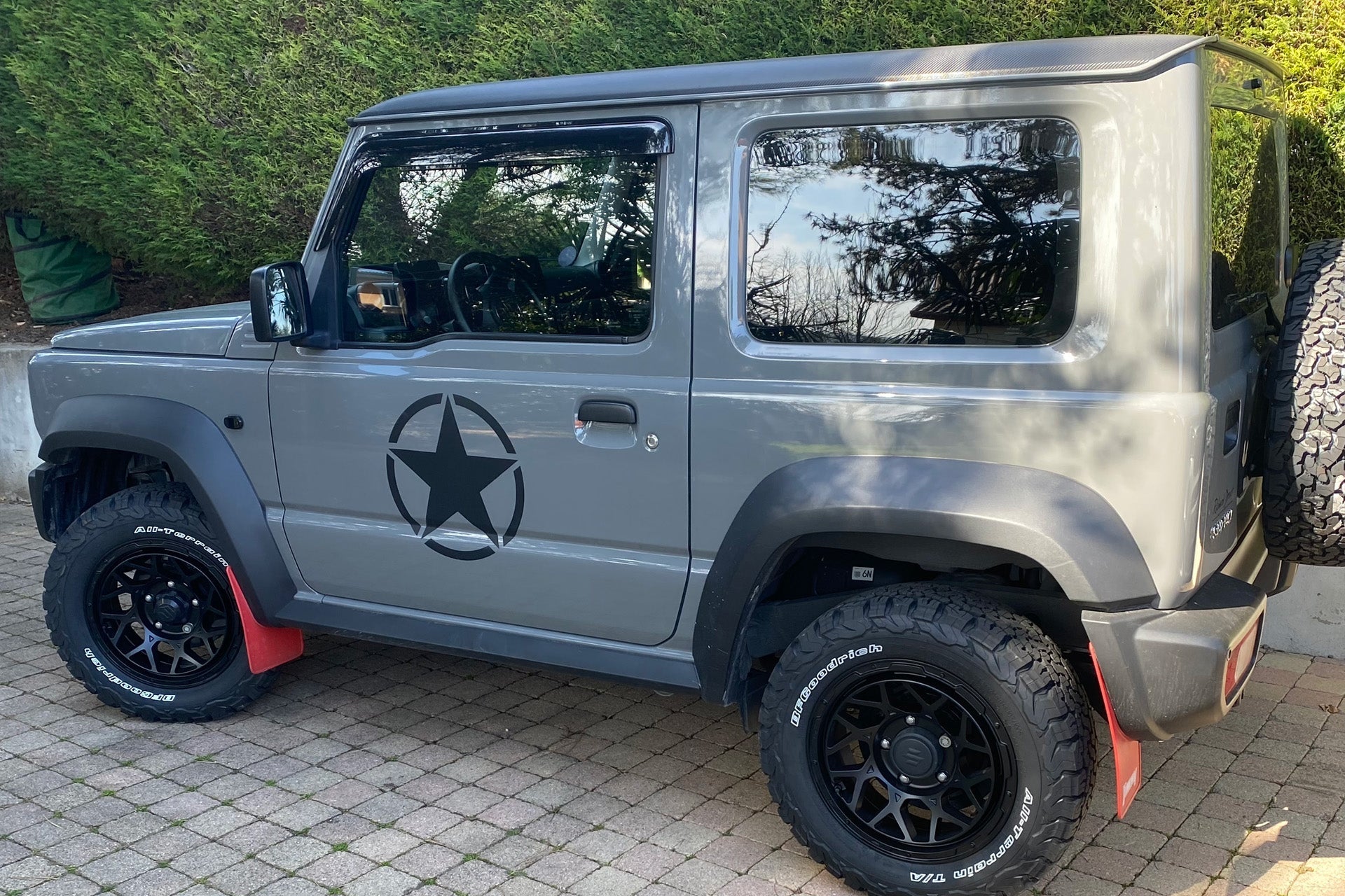Grey Suzuki Jimny (2018+) fitted with Satin Black Magpie M-01 wheels