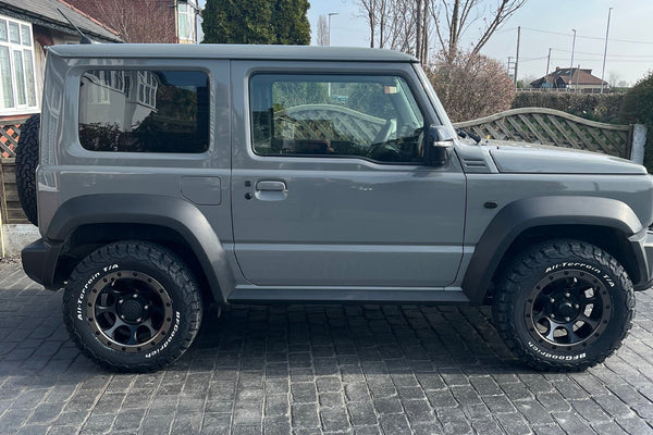 Grey Suzuki Jimny (2018+) fitted with XTREME-J XJ03 wheels and various smoked LED accessories