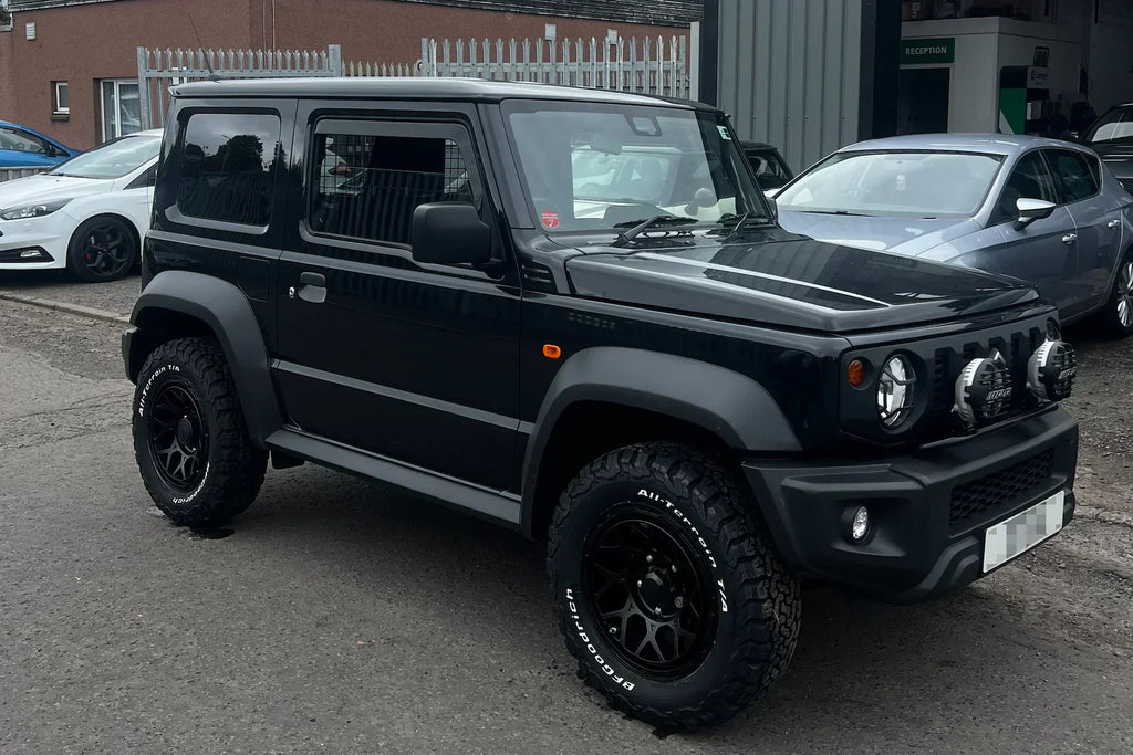 Black Suzuki Jimny (2018+) with 16" Magpie M-01 wheels in Satin Black and IPF 950 Super Rally LED Spot & Driving Hybrid Lamps