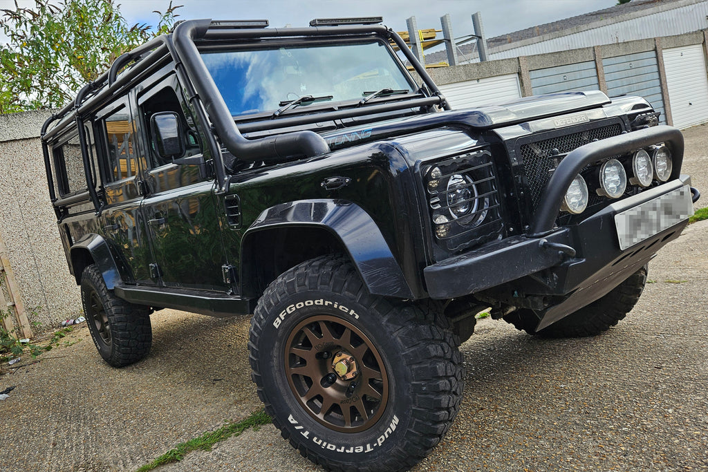 Black Land Rover Defender fitted with Matte Black EVO Corse DakarZero wheels